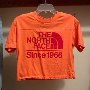 Orange The North Face crop t-shirt